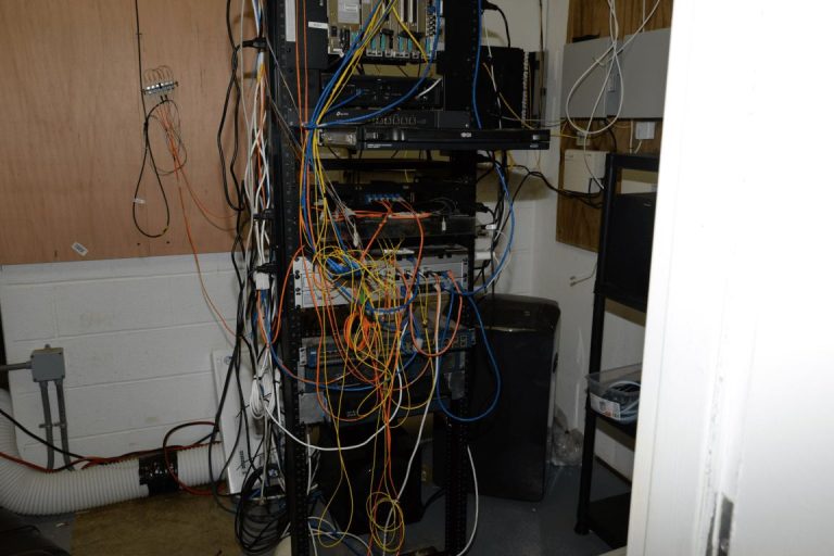 rows of network cables in a mining server room