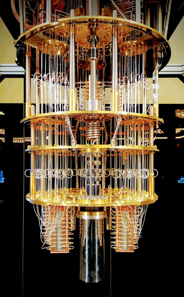 A quantum computer's intricate gold-toned hardware inside a research laboratory