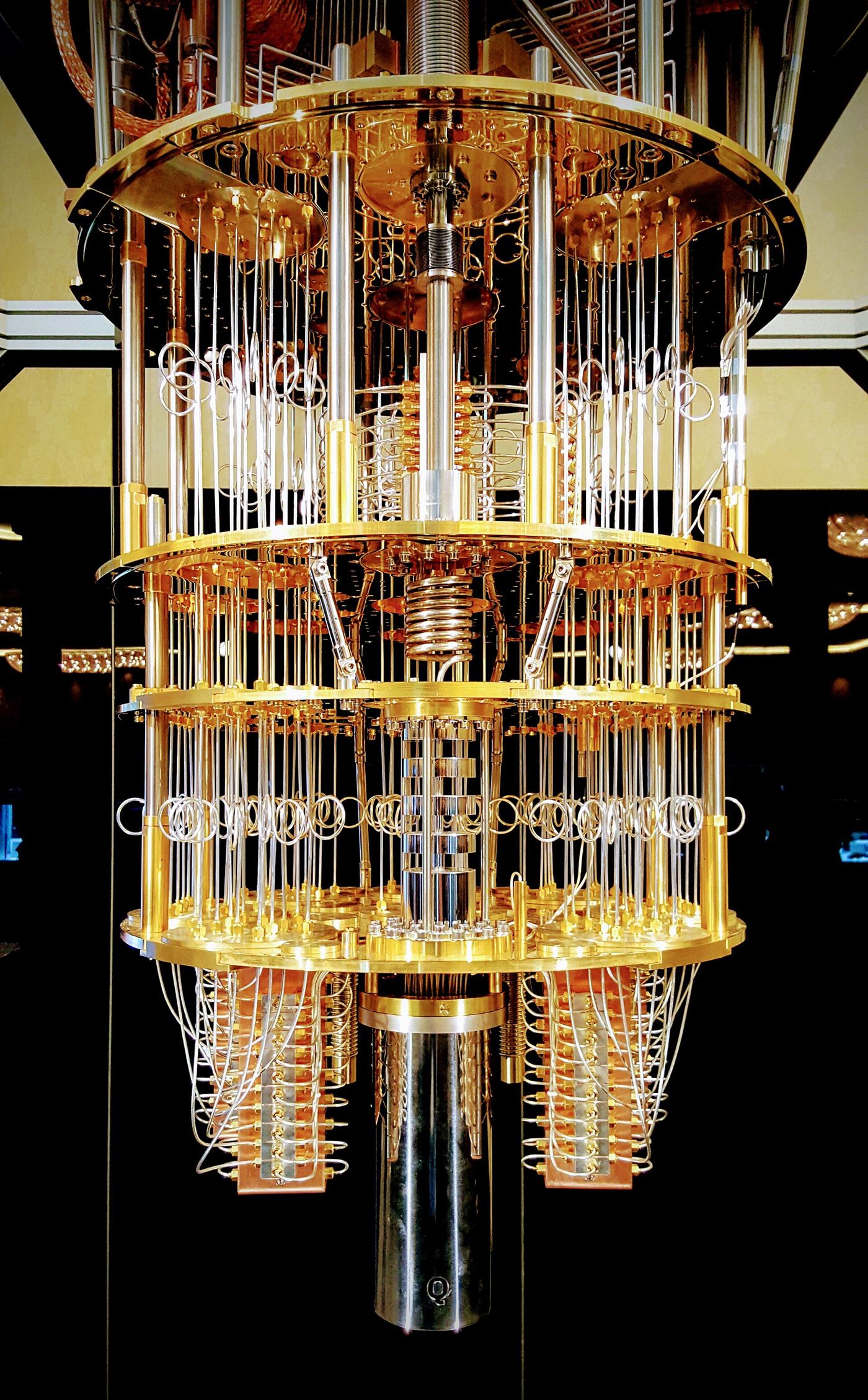 A quantum computer's intricate gold-toned hardware inside a research laboratory